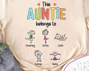 May include: A beige t-shirt with the text "This Auntie belongs to" and colourful stick figure drawings of children with names below each figure: Charley, Sofia, Josh, Daniel, Bella. The text "Text can be changed" is in a red box above the shirt.