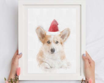 May include: A watercolor painting of a corgi wearing a red Santa hat. The corgi is looking directly at the viewer with a serious expression. The painting is framed in a white frame.