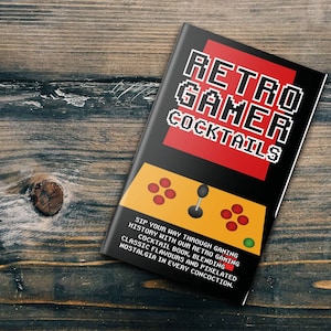 May include: A book cover with a red, black, and yellow design. The title is "Retro Gamer Cocktails". The cover features a retro video game controller with buttons and a joystick. The text on the cover reads "Sip your way through gaming history with our retro gaming cocktail book, blending classic flavors and pixelated nostalgia in every concoction."