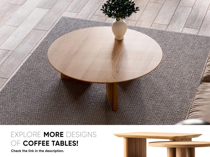 May include: A round wooden coffee table with three legs sits on a gray rug. A white vase with green foliage is on the table. The text "EXPLORE MORE DESIGNS OF COFFEE TABLES!" is at the bottom of the image.