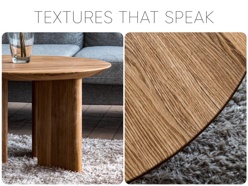 May include: A light brown, round wooden coffee table with a thick, curved base. The table has a natural wood grain finish. The text "TEXTURES THAT SPEAK" is at the top of the image. The table is on a gray rug.