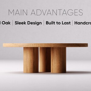 May include: A round wooden table with a natural wood finish and three legs. The table is made of solid oak and has a sleek design. The text "MAIN ADVANTAGES" is displayed above the table, and the text "Solid Oak | Sleek Design | Built to Last | Handcrafted" is displayed below the table.