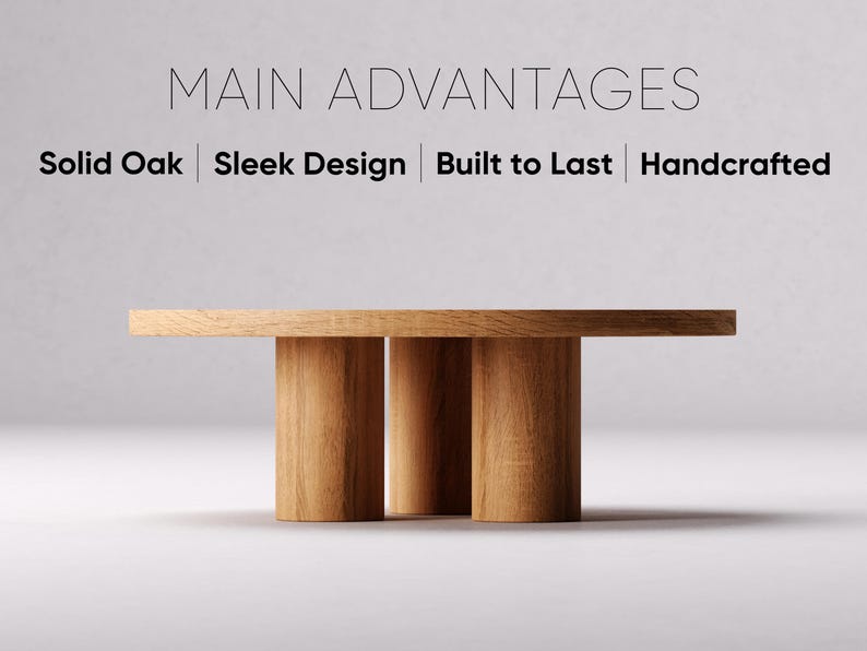 May include: A round wooden table with a natural wood finish and three legs. The table is made of solid oak and has a sleek design. The text "MAIN ADVANTAGES" is displayed above the table, and the text "Solid Oak | Sleek Design | Built to Last | Handcrafted" is displayed below the table.