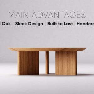 May include: A solid oak coffee table with a sleek design. The table has a rectangular top and two thick, rectangular legs with a single, thinner leg in the center. The text on the image reads: Main Advantages, Solid Oak, Sleek Design, Built to Last, Handcrafted.