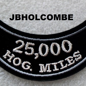 May include: Black motorcycle patch with white embroidered text that reads "25,000 HOG MILES".