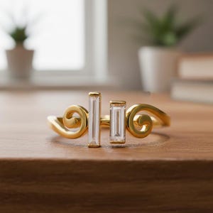 May include: A set of three ceramic mugs with a speckled, matte finish in cream, light grey, and dark grey. Each mug has a simple, minimalist design, ideal for coffee or tea.