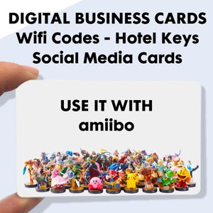 May include: A white business card with the text "DIGITAL BUSINESS CARDS Wifi Codes - Hotel Keys Social Media Cards" and "USE IT WITH amiibo." The card is held in a hand and features a collection of colorful amiibo figures.