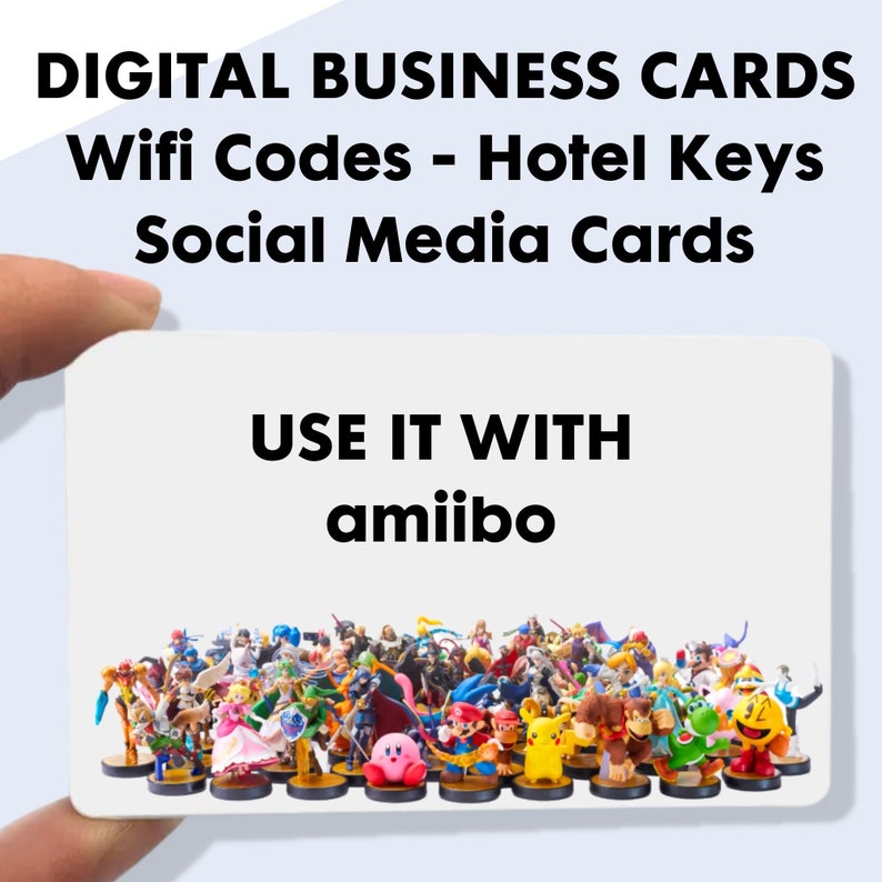 May include: A white business card with the text "DIGITAL BUSINESS CARDS Wifi Codes - Hotel Keys Social Media Cards" and "USE IT WITH amiibo." The card is held in a hand and features a collection of colorful amiibo figures.