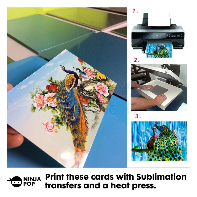 May include: A square card featuring a peacock design with vibrant blue, green, and orange feathers, pink flowers, and a blue sky background. The image shows the card being printed, pressed, and the final product. Text: Print these cards with Sublimation transfers and a heat press.