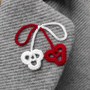 Martisor. Martisoare. Baba Marta. Martenitsa. Spring amulet. Moldova. Romanian martisor. Crocheted clover. Märzchen. Martakia. Martis.