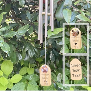 May include: A wooden wind chime with a metal chime tube and a personalised wooden tag with a photo of a dog and the text "Listen to the wind and think of me. In your heart, I'm always here. Alfie".