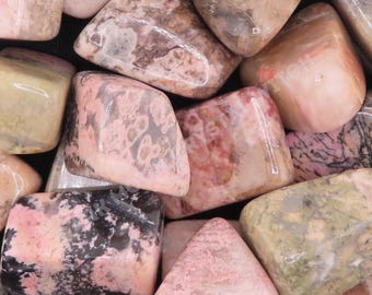 May include: A collection of tumbled pink, brown, and gray stones with a variety of patterns. The stones are smooth and polished.