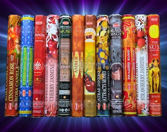 May include: A collection of incense sticks in various colors, each labeled with a different scent. The packaging features text such as "Cinnamon Rose," "Cherry Jasmine," and "Strawberry Jasmine." The background is a gradient of purple and blue.