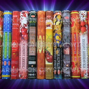 May include: A variety pack of HEM incense sticks with different scents and designs. The scents include Cinnamon Rose, Frankincense-Myrrh, Cherry Jasmine, Amber, Attracts Money, Dragons Blood, Strawberry Jasmine, and The Sun. The sticks are packaged in colorful boxes with images of flowers, fruits, and other designs.