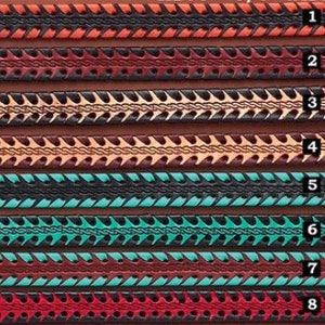May include: Eight horizontal leather strips labeled one through eight, each featuring a central braided pattern flanked by serrated edges. The strips display various color combinations including orange, dark red, tan, turquoise, and bright red accents.