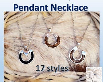 May include: Three silver pendant necklaces with horseshoe designs, each featuring horsehair. The necklaces hang on delicate chains. The text "Horsehair Keepsake Pendant Necklace" is at the top, with "17 styles" below. A logo is in the bottom right corner.