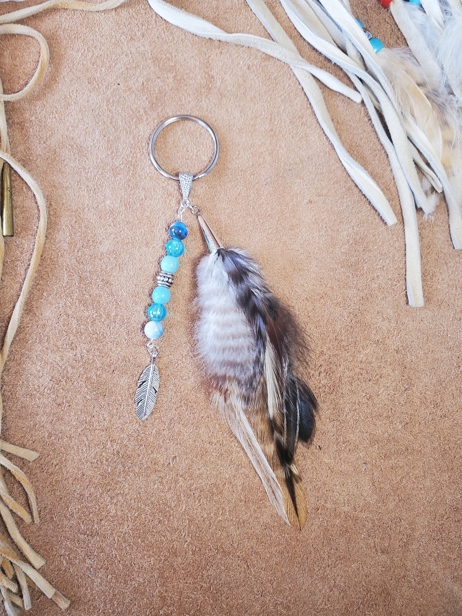 Keyring With Beads, Feathers and Charm - Metal Feather, Horse, Revolver ...
