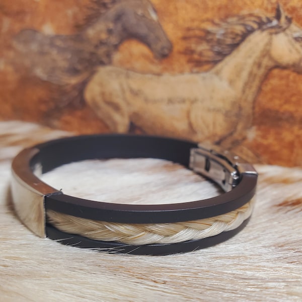 Horse Hair braided bracelet inset into imitation leather band with stainless steel clasps and slider bar.  Horse hair keepsake.