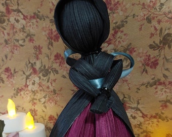 Raspberry and gray corn husk doll