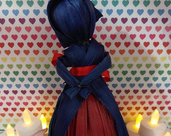 Blue and red corn husk doll