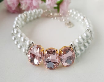 White pearl necklace for dogs and cats with rhinestone dividers and pink-colored glass beads