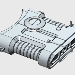 Op de afbeelding: Een lichtgrijs, futuristisch ogend apparaat met een complex ontwerp. Het heeft een cirkelvormige opening, geribbelde secties en een klein rood licht. Het object heeft een handvatachtige structuur en diverse geometrische details.