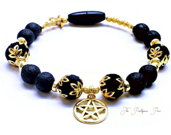 May include: Black lava rock and gold bead bracelet with a gold pentacle charm. The bracelet has a black obsidian bead and the text "The Pretentious Paw" is visible in the bottom right corner of the image.