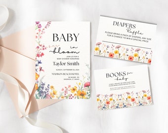 May include: Baby shower invitation with a floral design. The invitation says "Baby in Bloom" and includes the name "Taylor Smith". The invitation also includes the date, time, and location of the shower. There are also two cards for a diaper raffle and a book request.