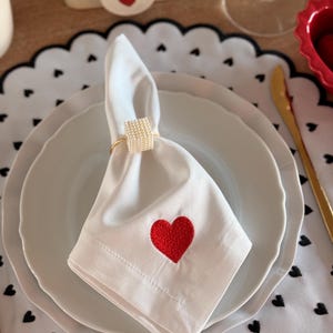 White napkin with red heart