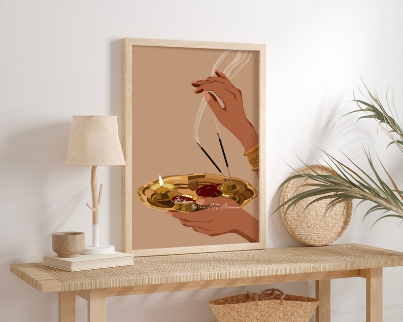 May include: A digital illustration of a hand holding a golden plate with lit candles and incense sticks. The background is a light brown color.