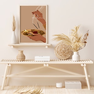 May include: A digital illustration of a person's hands holding a golden plate with a lit candle and incense sticks. The background is a light brown color.