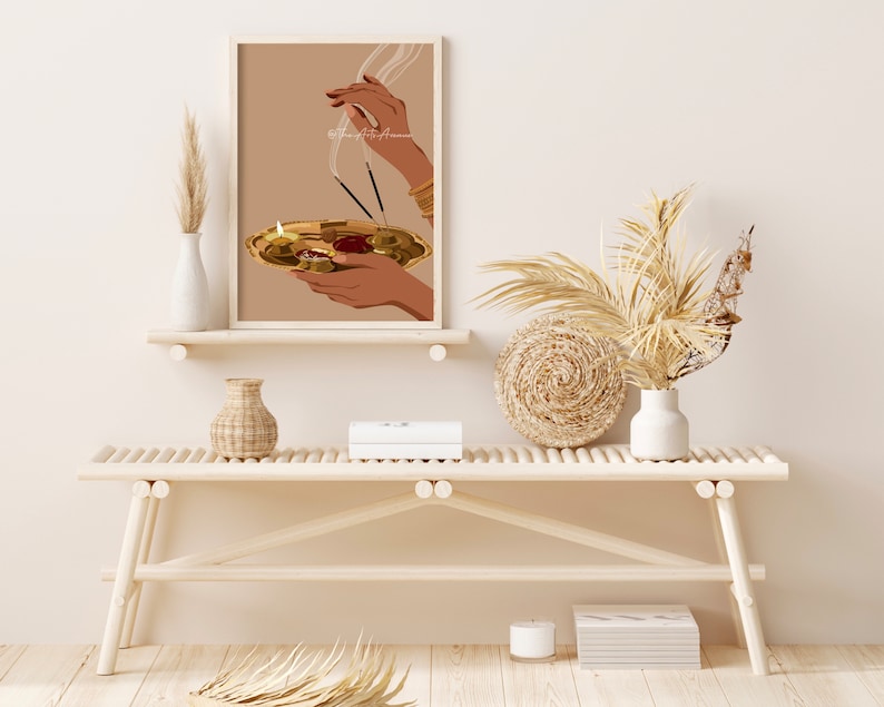 May include: A digital illustration of a person's hands holding a golden plate with a lit candle and incense sticks. The background is a light brown color.