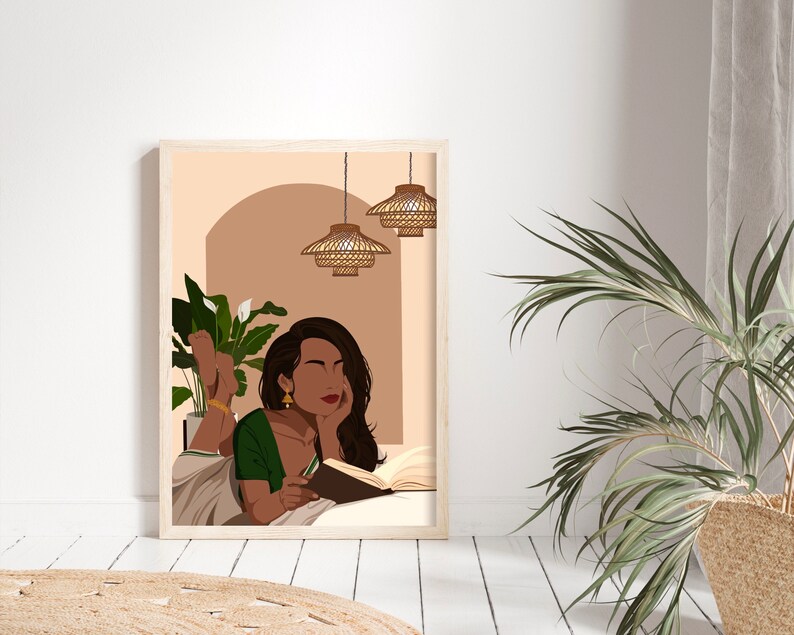 May include: A digital illustration of a woman with long dark hair, wearing a green sari, lying on a bed and reading a book. The background is a peach color with a brown archway and two hanging wicker lights.