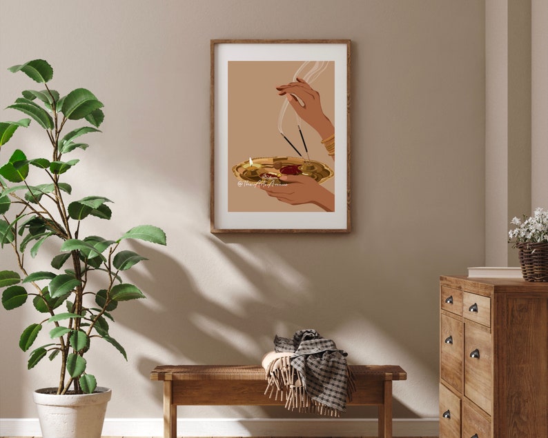 May include: A digital illustration of a hand holding a golden plate with incense burning. The plate is decorated with a red flower and the hand is wearing gold bracelets.