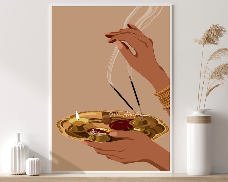 May include: A person's hands hold a golden tray with a lit candle, incense sticks, and other offerings. The background is a light brown color.