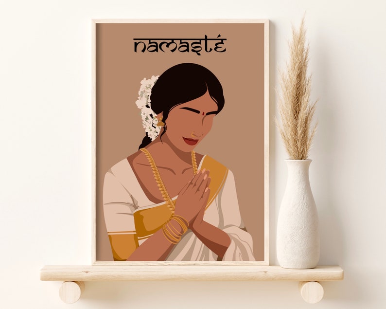 May include: A digital illustration of a woman in a white and gold sari with her hands clasped in a prayer position. The background is a light brown color and the text "namaste" is written in black at the top of the image.
