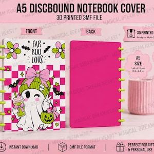May include: A digital 3D printable A5 discbound notebook cover file featuring a front design with a white ghost wearing a green beanie and pink bow, holding a green drink and pumpkin, set against a pink and white checkerboard background with text.