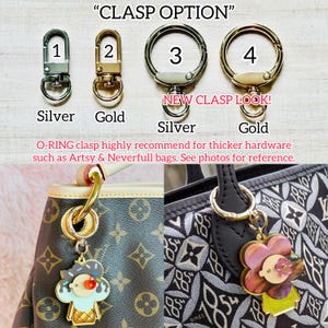 May include: Four different clasp options for bags, labeled 1 through 4.  The clasps are silver, gold, silver, and gold.  The text "NEW CLASP LOOK!" is written below the clasps.  The text "O-RING clasp highly recommend for thicker hardware such as Artsy & Neverfull bags. See photos for reference." is written below the clasps.  Two photos show the clasps attached to designer handbags.