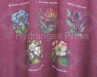 Camiseta con estampado floral botánico de la versión oscura del espacio profundo vintage de Bella + Canvas
