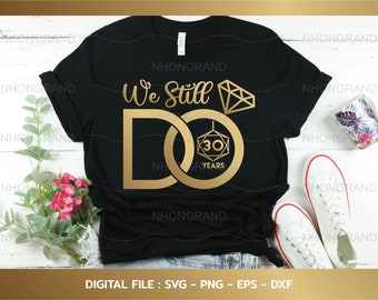 May include: Black t-shirt with gold text that reads "We Still Do" and a gold ring with a diamond and the number 30 inside. The text "30 Years" is below the ring.