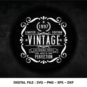 May include: A white vintage design with a black background. The design features a decorative frame with a star, a wreath, and the text "1997 Limited Edition *Vintage* All Original Parts Aged to Perfection".