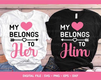 May include: Two white t-shirts with black text and a pink heart design. The text on the shirts reads "My Belongs To Her" and "My Belongs To Him".