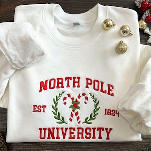 North Pole University Embroidered Sweatshirt, Christmas Embroidery,Christmas Embroidered Hoodie, Christmas Candy Sweater,Christmas Gift