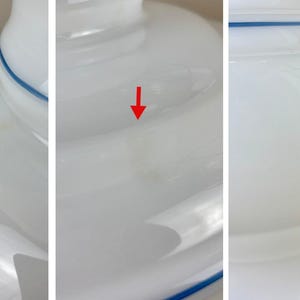 May include: White ceramic lampshade with a blue trim. The lampshade has three visible imperfections.