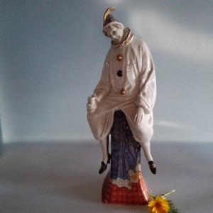 Clown on church spire ,porcelain sculpture hand-painted