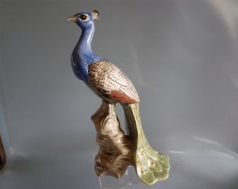 Peacock figurine made of porcelain, hand-painted