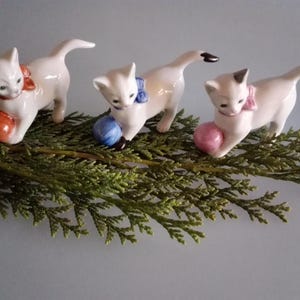 Porcelain cat figurines with ball