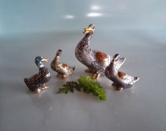 Perky ducks made of porcelain, hand-painted with luster