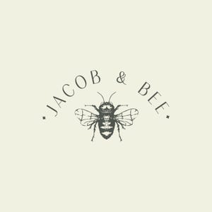 May include: A black and white illustration of a bee with the text "JACOB & BEE." above it.