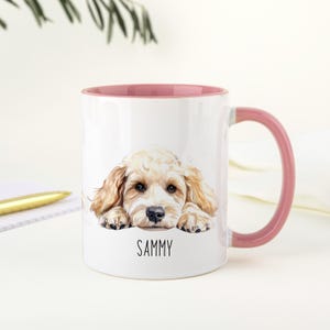 May include: White ceramic mug with a pink interior and handle. The mug features a watercolour illustration of a light brown dog with the name "SAMMY" printed below the dog.